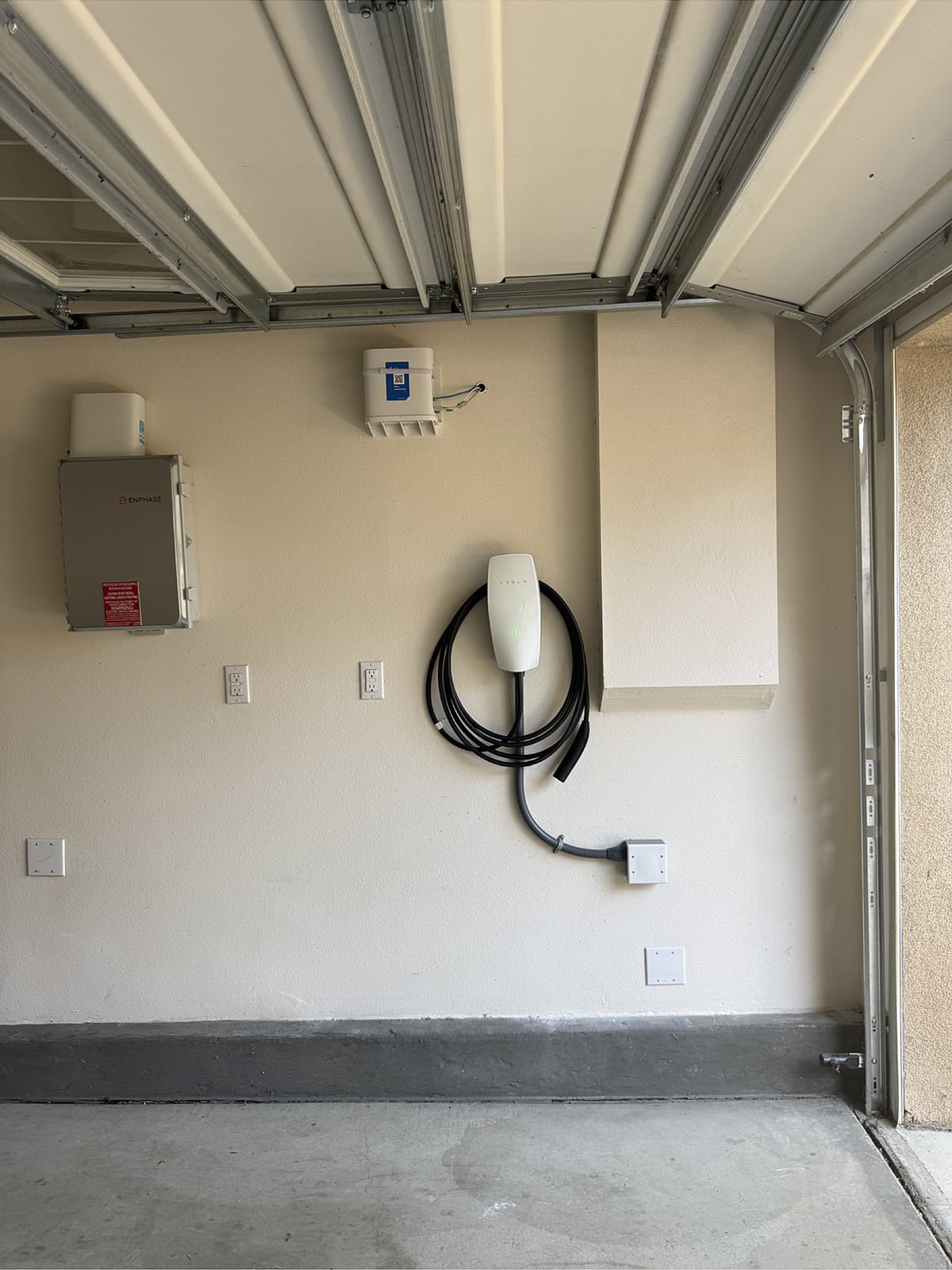 Tesla Wall Connector EV charger installed by A-Tech Electric in a residential garage in Fontana, California.